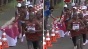 French Marathon Runner Appears To Knock Water Bottles To The Floor On Purpose