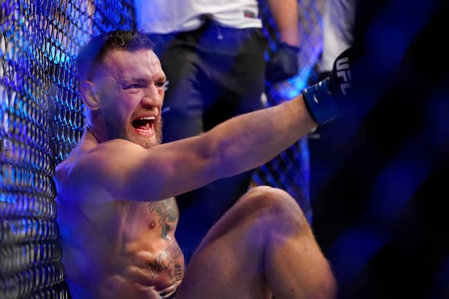 McGregor was still involved in trash talk as he sat in agony on the ground. Image: PA Images