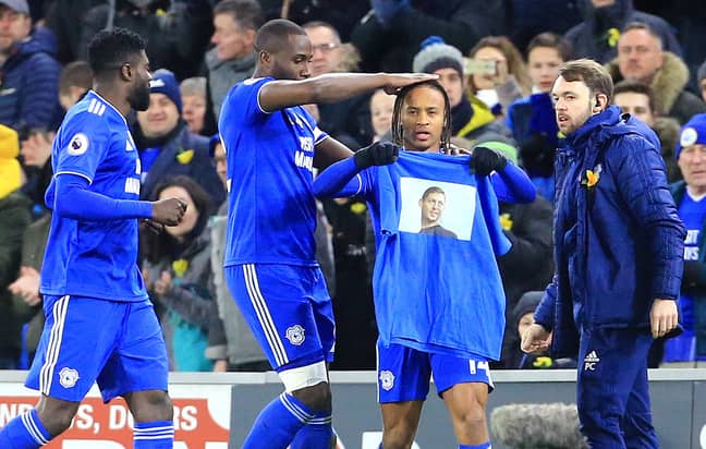 Reid celebrates one of his goals by holding up a shirt with Sala's face on. Image: PA Images
