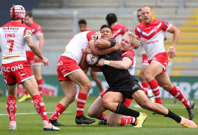 Israel Folau is tackled by St Helens players. Credit: PA