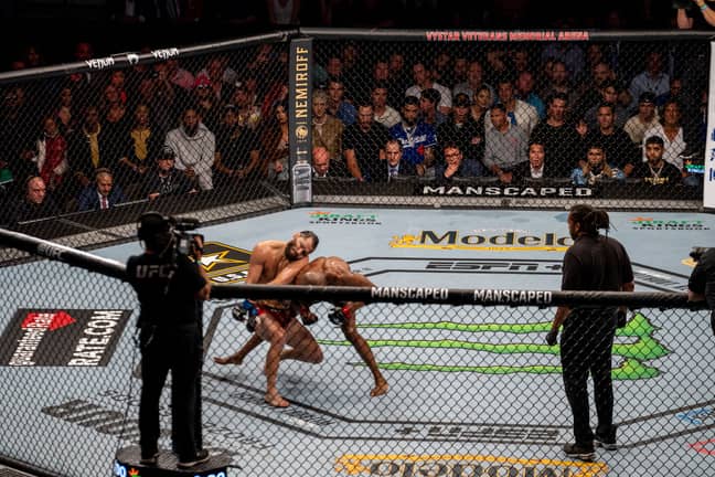 An incredible image showing the end of UFC 261's main event. Image: UFC