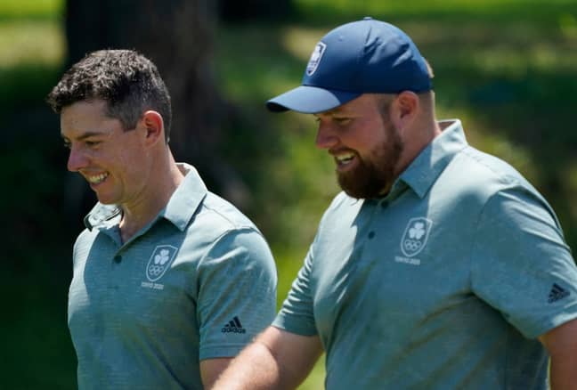 Rory McIlroy and his teammate Shane Lowry speak during a practice round of the men's golf event at the 2020 Summer Olympics. (Credit: PA)