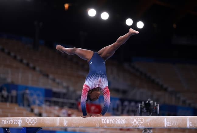Simone Biles prepares to compete in the Women's Balance Beam final. (Credit: PA)