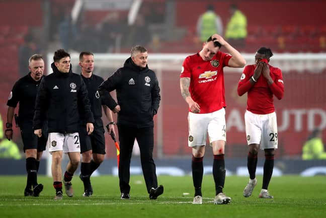 United players and management trudge off after the embarrassing night at Old Trafford. Image: PA Images