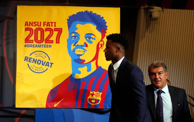 Ansu Fati with president Joan Laporta during a press conference to announce his new contract at Barcelona. Image credit: Alamy