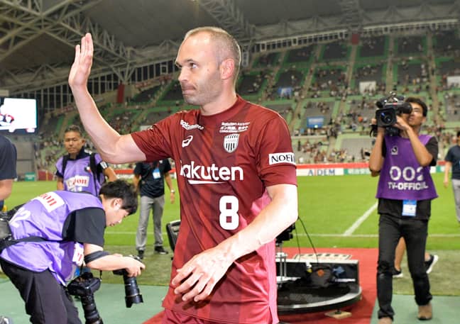 Iniesta waves to the fans. Image: PA