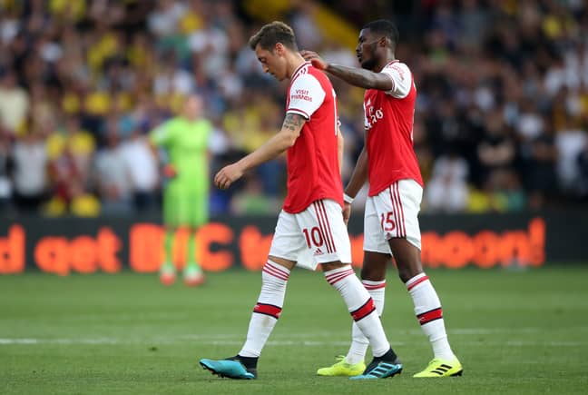 Arsenal players walk off the pitch after throwing away a win against Watford. Image: PA Images