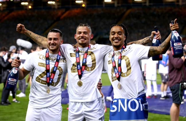 Phillips, centre, celebrates promotion with his Leeds' teammates. Image: PA Images