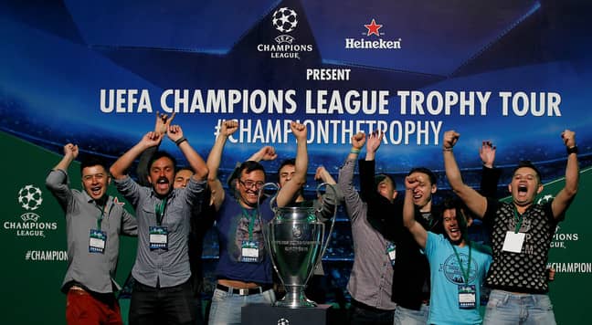 Fans having picture taken with Champions League trophy