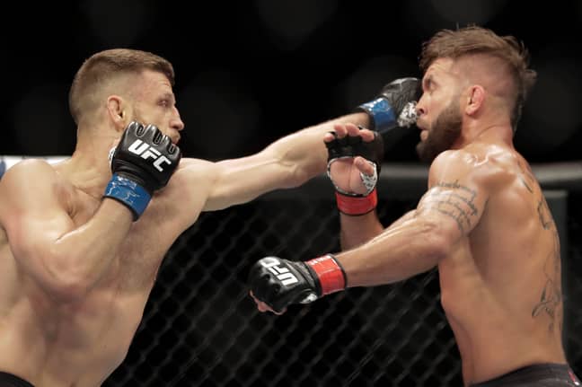 Calvin Kattar, left, strikes Jeremy Stephens, right, during their bout. (Image Credit: PA)