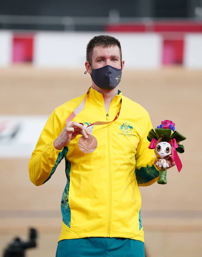 Australia's Darren Hicks celebrates with his silver medal after finishing second in the Men's C2 3000 metres Individual Pursuit. Credit: PA