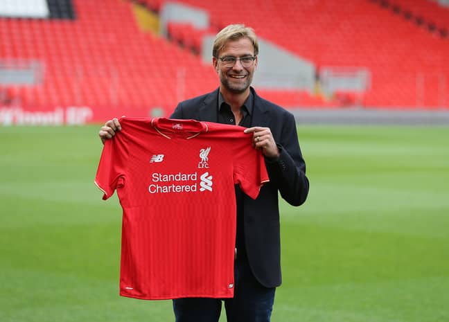 Klopp holding up his new shirt. Image: PA Images