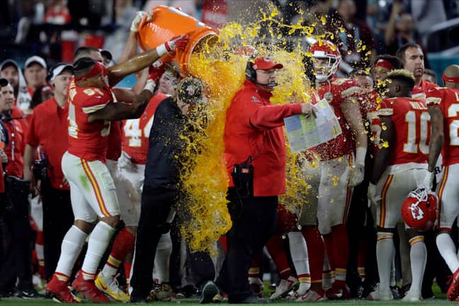 Chiefs head coach Andy Reid is covered in Gatorade by his players