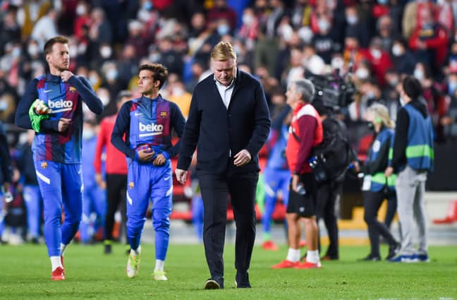 PA: Ronald Koeman trudges off the pitch after Barcelona's defeat to Rayo Vallecano.