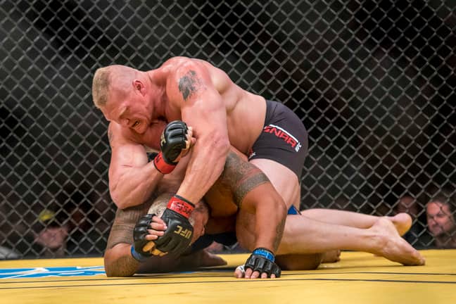 Lesnar beats up Mark Hunt at UFC 200. Image: PA