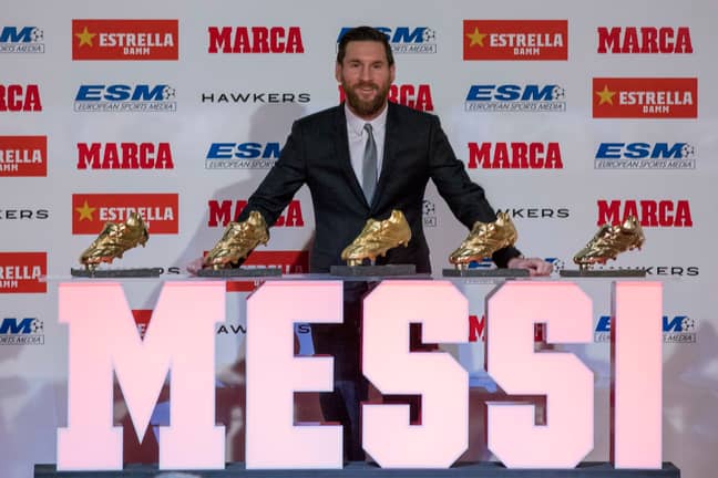 Messi poses in front of his Golden Boot awards. Image: PA
