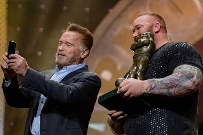 Bjornsson poses with Arnold Schwarzenegger for a selfie after winning his second consecutive Arnold Pro Strongman. Image: PA Images