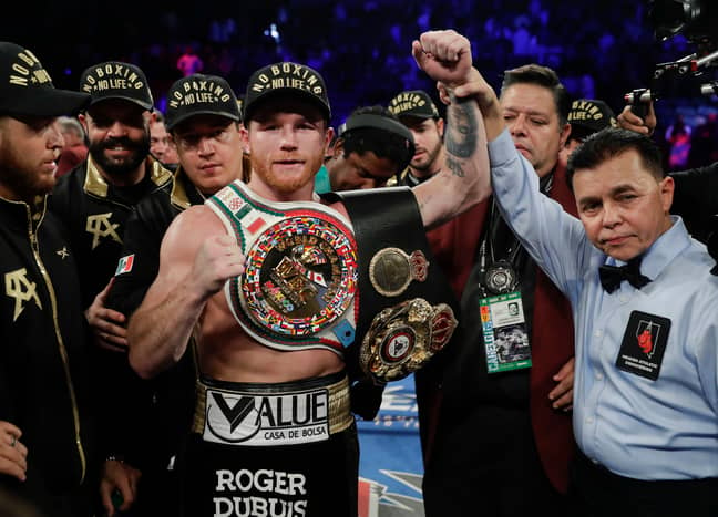 Canelo with his world titles. Image: PA