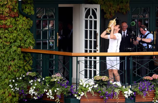 Murray kisses his second Wimbledon trophy. Image: PA Images