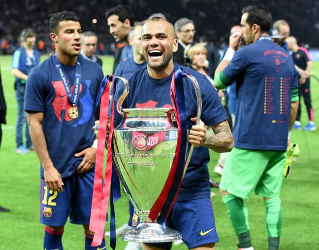 PA: Dani Alves celebrates winning the Champions League in 2015.