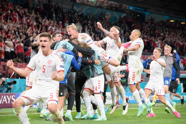 Denmark players celebrate going through after an emotional couple of weeks. Image: PA Images