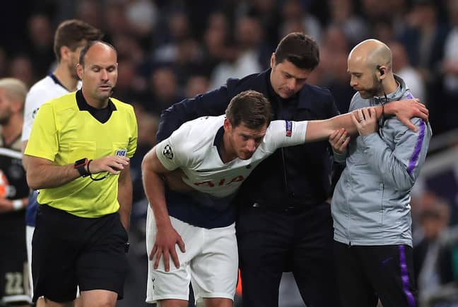 Vertonghen being helped by manager Mauricio Pochettino and officials (Image Credit: PA)