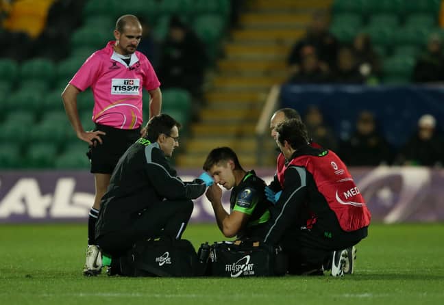 Northampton's Piers Francis gets checked by a doctor before leaving the pitch for an HIA. Image: PA Images