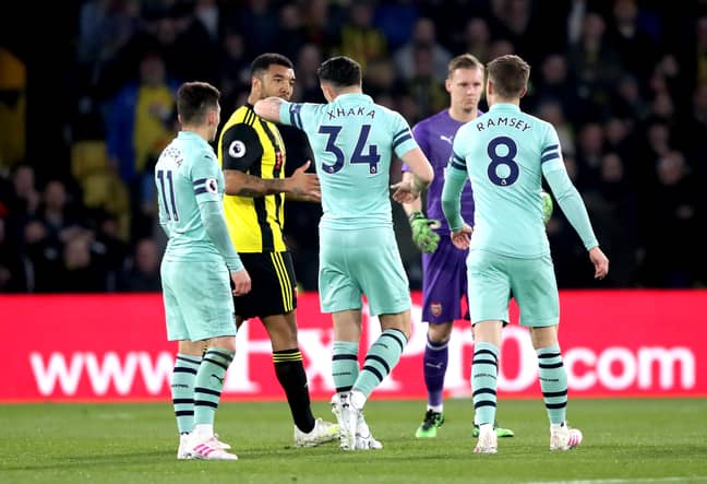 Xhaka explains to Deeney why he's been sent off, as if he didn't know. Image: PA Images
