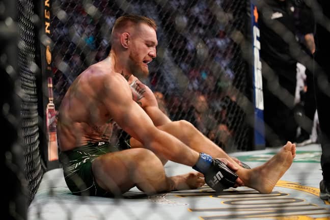 McGregor sits dejected on the octagon floor after his loss. Image: PA Images