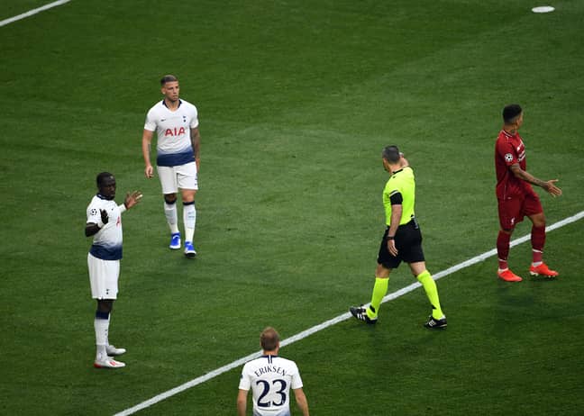 The referee points to the spot after Moussa Sissoko's handball. Image: PA Images