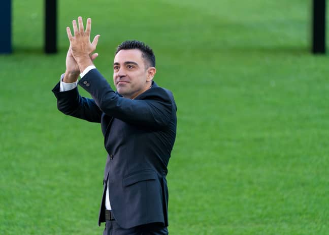 PA: Xavi applauds the fans after being confirmed as Barcelona's new head coach.