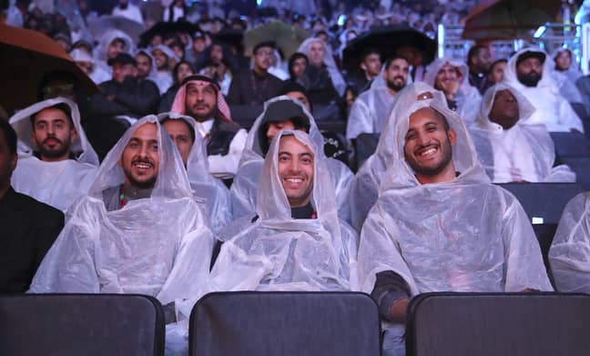 Boxing fans were forced to shelter from the rain in Saudi Arabia