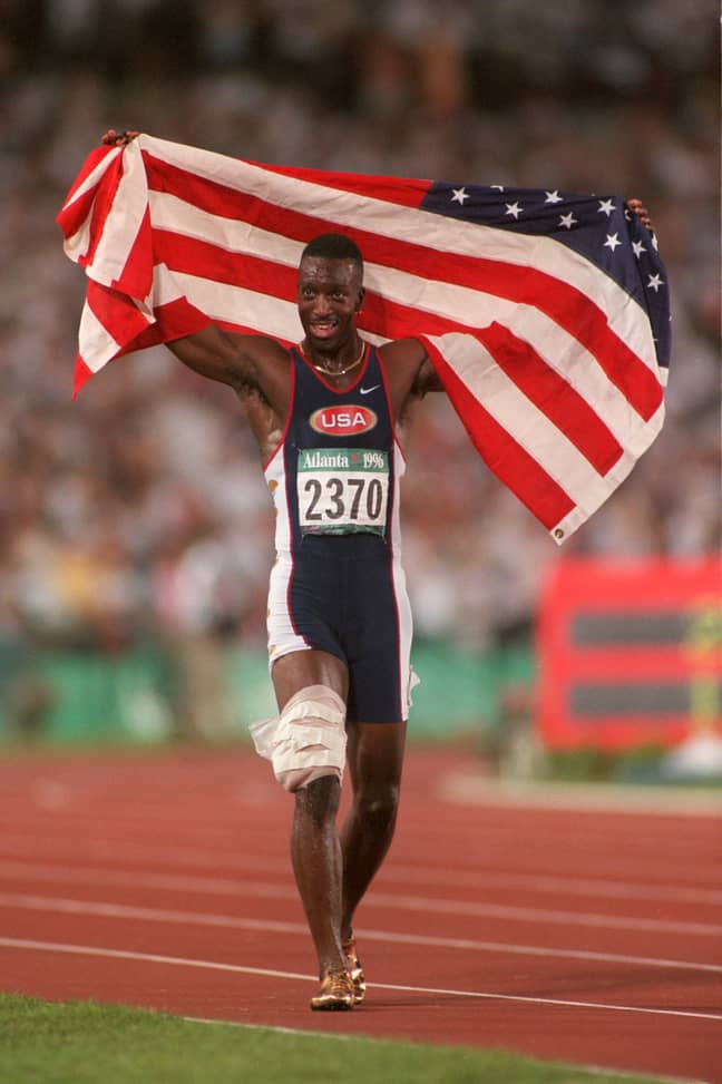 Michael Johnson celebrates after winning gold in 1996. Credit: PA