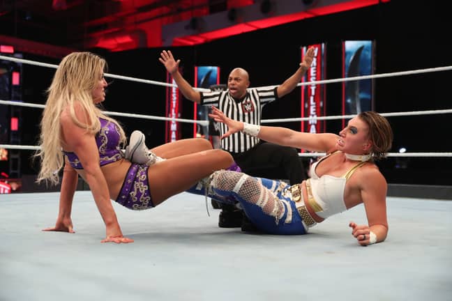 Charlotte (L) made Rhea Ripley (R) tap to the Figure Eight on Sunday night. (Image Credit: WWE)