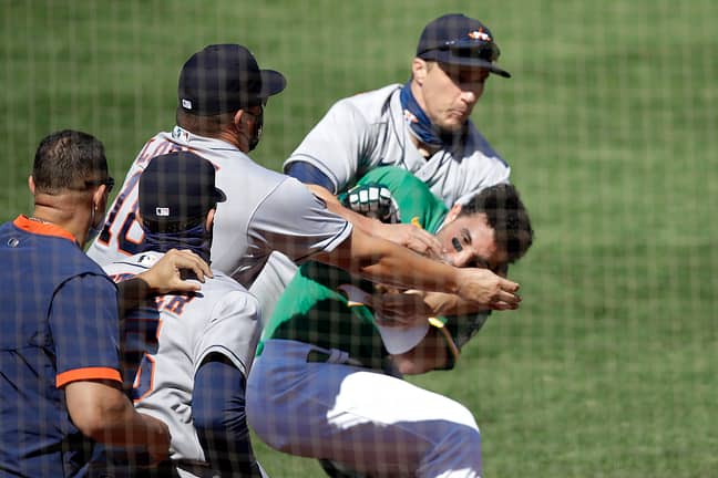 Laureano charges the Houston Astros' dugout. Credit: PA