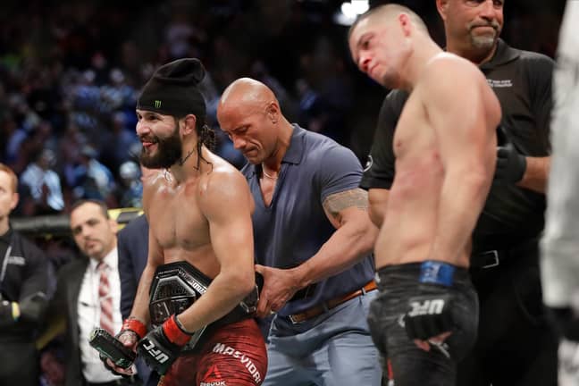 The Rock places the new belt on to Masvidal's waist. Image: PA Images