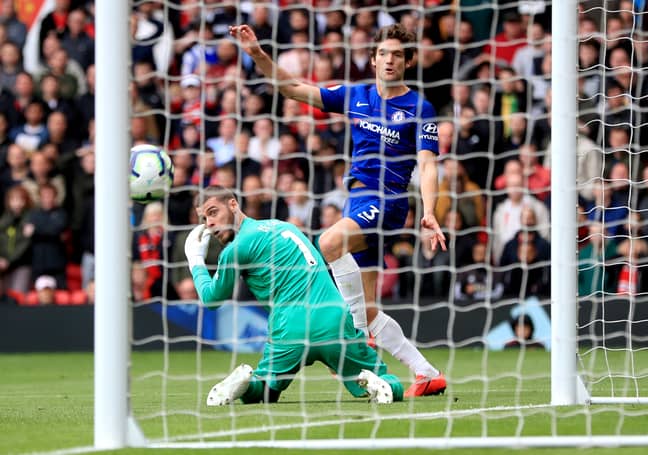 De Gea watches Marco Alonso captialise on his mistake in United's 1-1 draw against Chelsea. (Image Credit: PA).