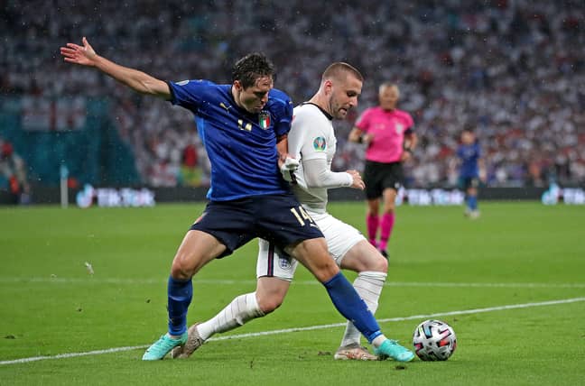 Shaw battles with Federico Chiesa. Image: PA Images