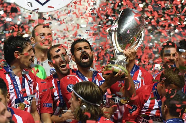 Costa holds aloft the Super Cup. Image: PA