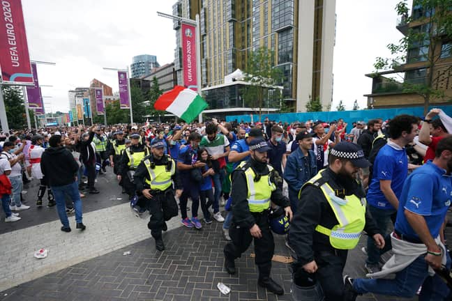 Italy fans given a police escort into the stadium. Image: PA Images