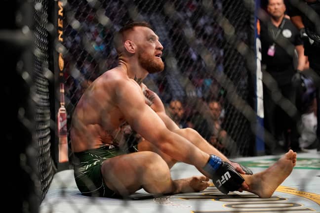 McGregor sits prone on the octagon floor after losing to Poirier. Image: PA Images