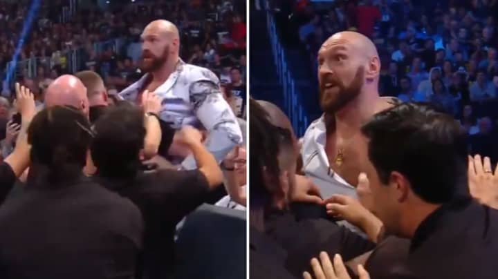 Tyson Fury Jumps The Barrier And Held Back By Security At WWE Smackdown